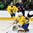 GRAND FORKS, NORTH DAKOTA - APRIL 16: Sweden's Filip Larsson #30 makes the save while Lias Andersson #26 and USA's Logan Brown #27 look on during preliminary round action at the 2016 IIHF Ice Hockey U18 World Championship. (Photo by Minas Panagiotakis/HHOF-IIHF Images)

